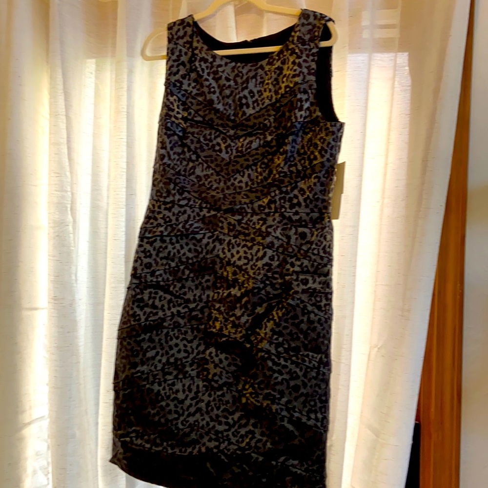 Silver and black sleeveless dress with long zipper in back.